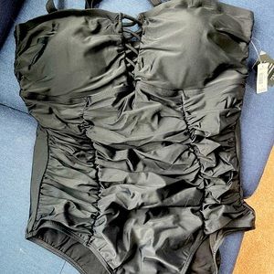BNWT Torrid black one piece swimsuit with cris-cross cleavage detail.